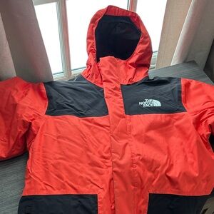 The North Face Large Boys Jacket in Bold Orange and Black
